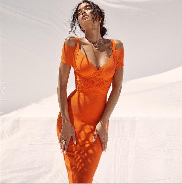 Orange Nysara off-shoulder bandage dress with V-neck, mid-calf hem, and elegant straps, perfect for cocktail events.