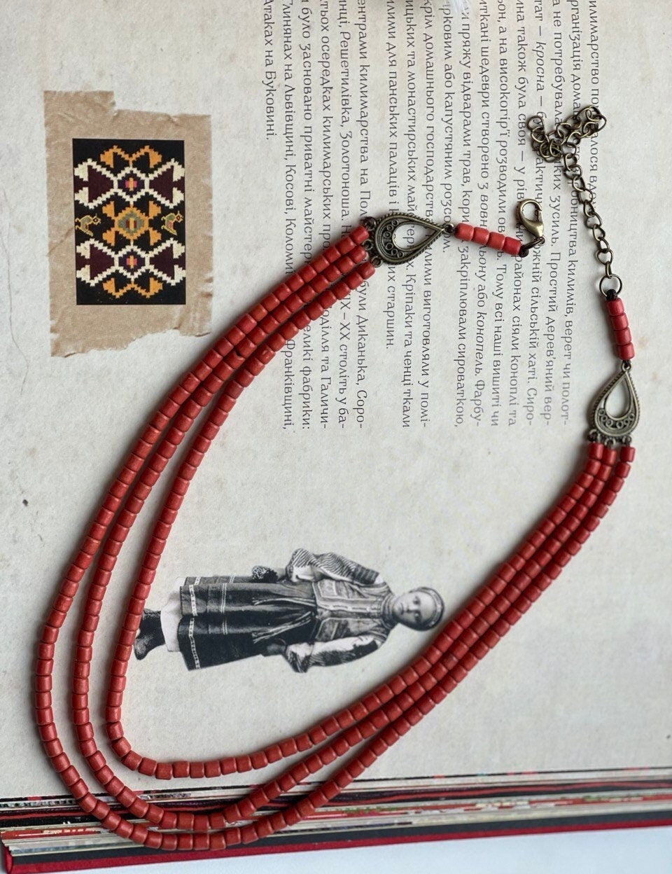 Handmade red ceramic beaded necklace in Hutsul style, showcasing traditional Ukrainian ethnic jewelry.