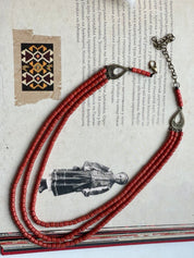 Handmade red ceramic beaded necklace in Hutsul style, showcasing traditional Ukrainian ethnic jewelry.