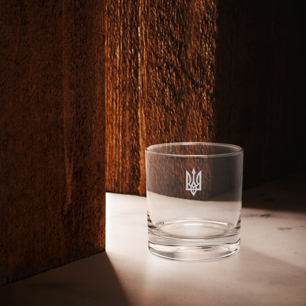Rocks glass featuring Ukrainian Trizub emblem, made of premium glass, ideal for whiskey and cocktails, 10.5 oz capacity.
