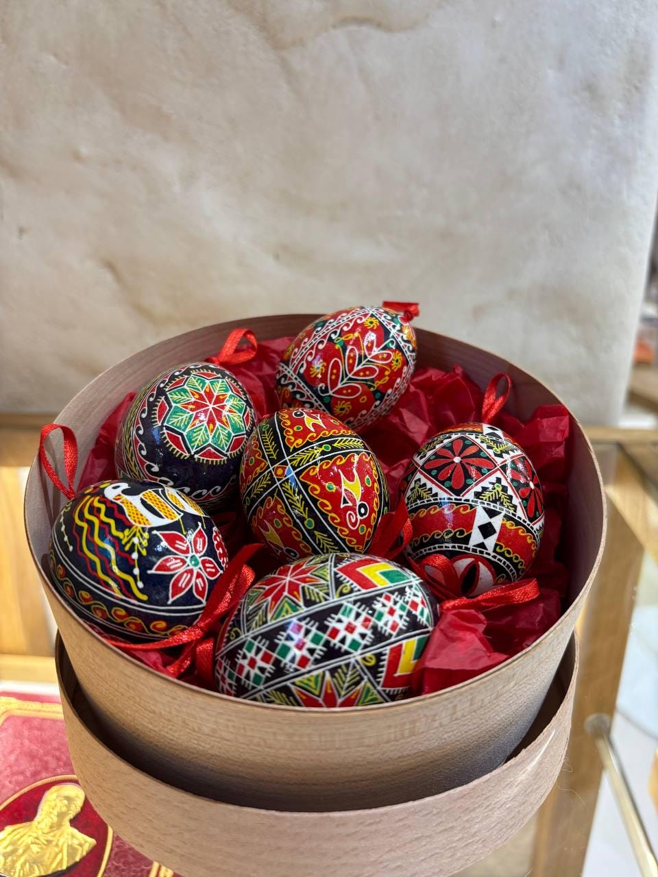 Set of 6 hand-painted Ukrainian Pysanky Easter eggs in a box, featuring colorful folk symbols on real chicken eggshells. Cultural craftsmanship.