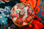 Set of 6 hand-painted Ukrainian Pysanky Easter eggs from blown chicken shells, featuring traditional folk designs and vibrant colors.