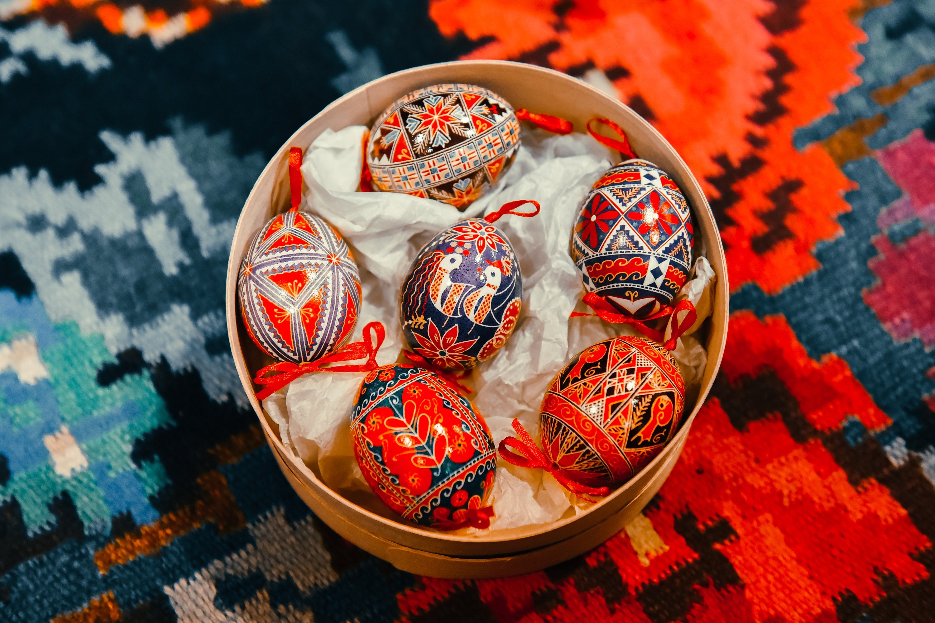 Set of 6 hand-painted Ukrainian Pysanky Easter eggs from blown chicken shells, featuring traditional folk designs and vibrant colors.