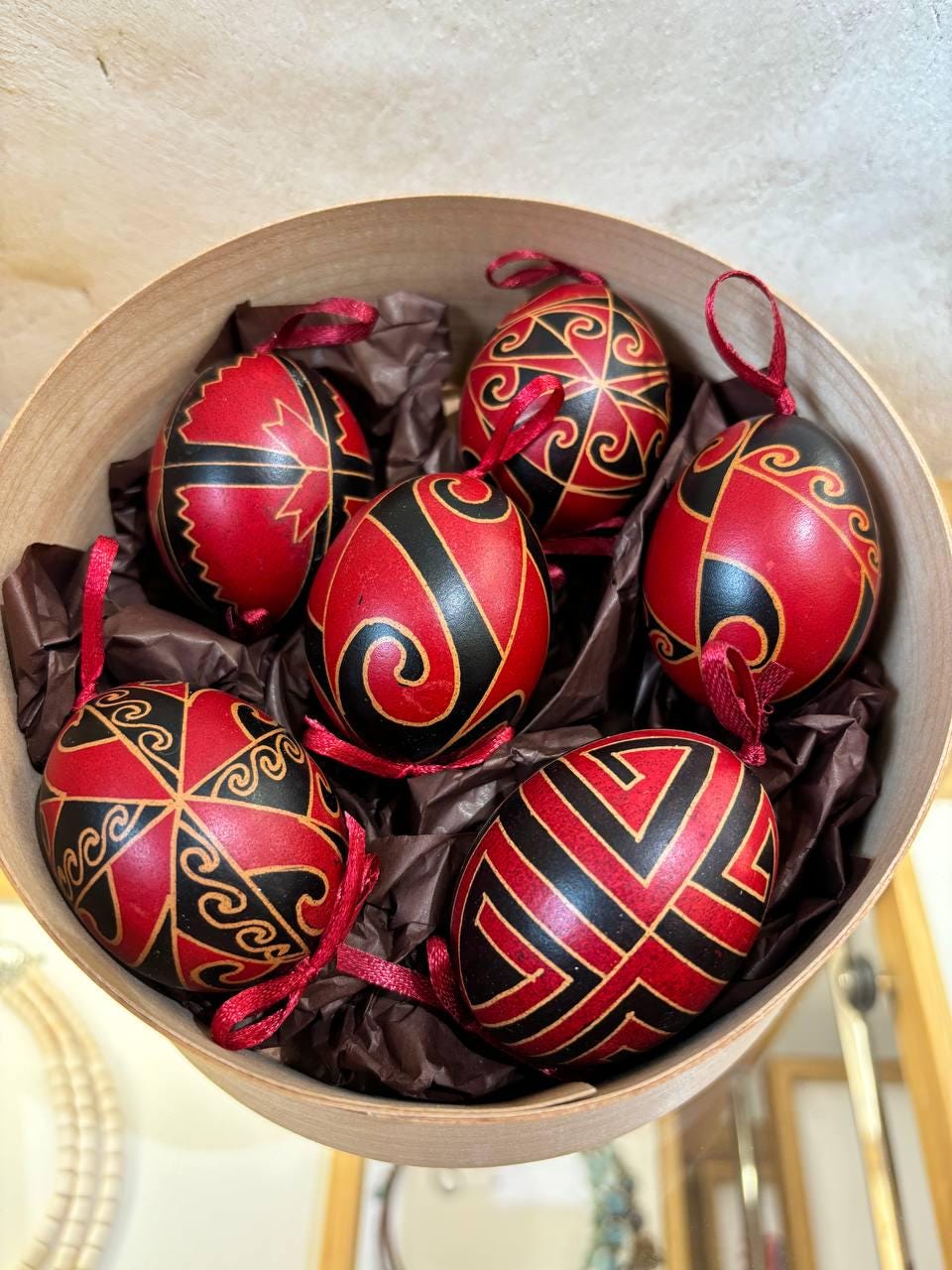 Set of 6 hand-painted Ukrainian Pysanky eggs in a decorative box, showcasing traditional folk art using the beeswax-resist technique.