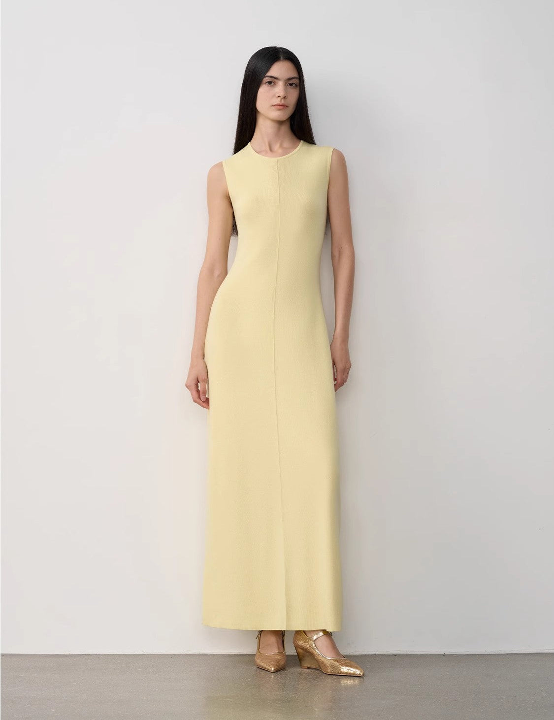 Elegant Solenne Merino Wool Maxi Knit Dress in yellow, showcasing minimalist design with sleeveless cut and ankle-length fit.