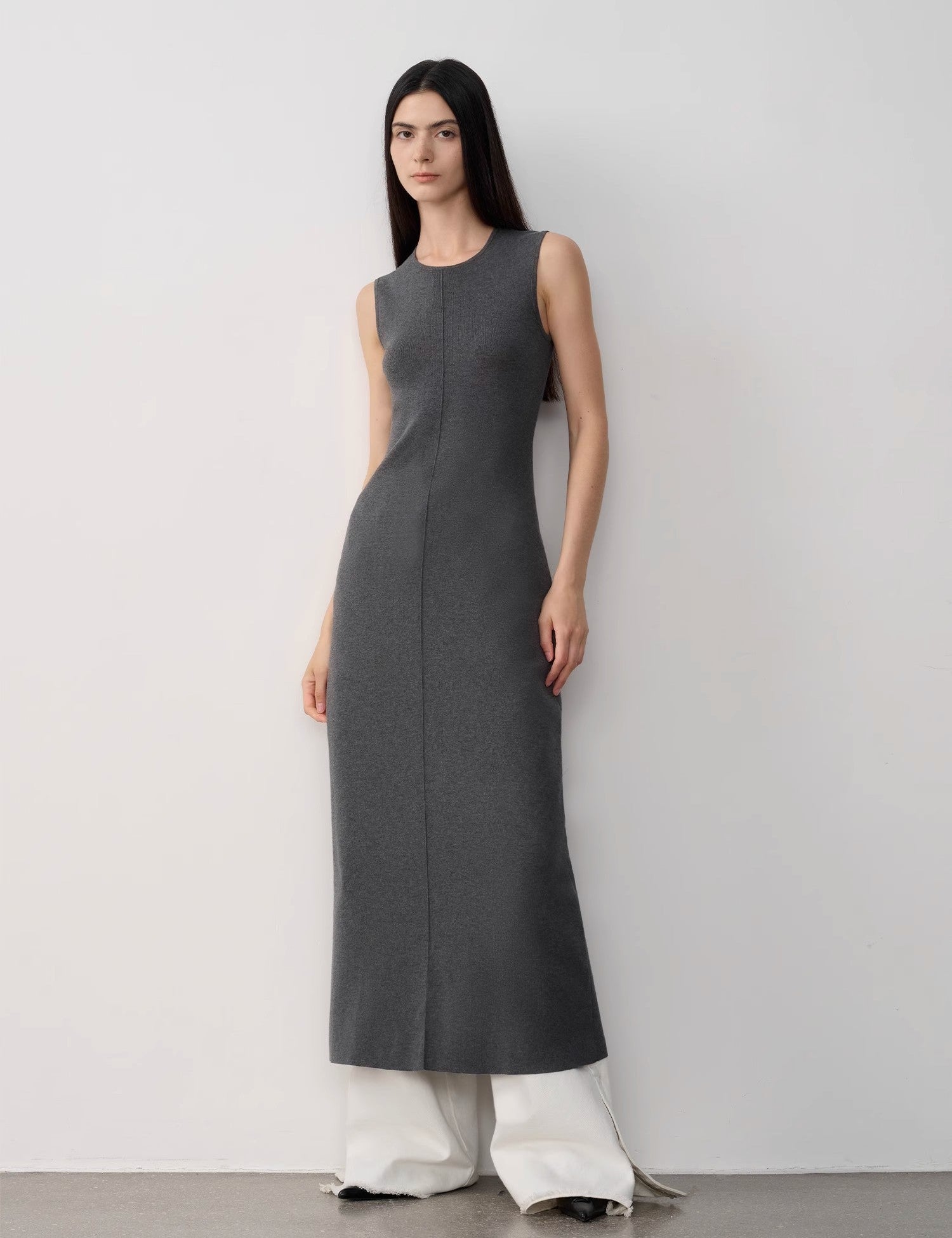 Alt Tag: Woman wearing Solenne Merino Wool Maxi Knit Dress with minimalist design and ankle-length cut, made from cotton and merino wool blend.