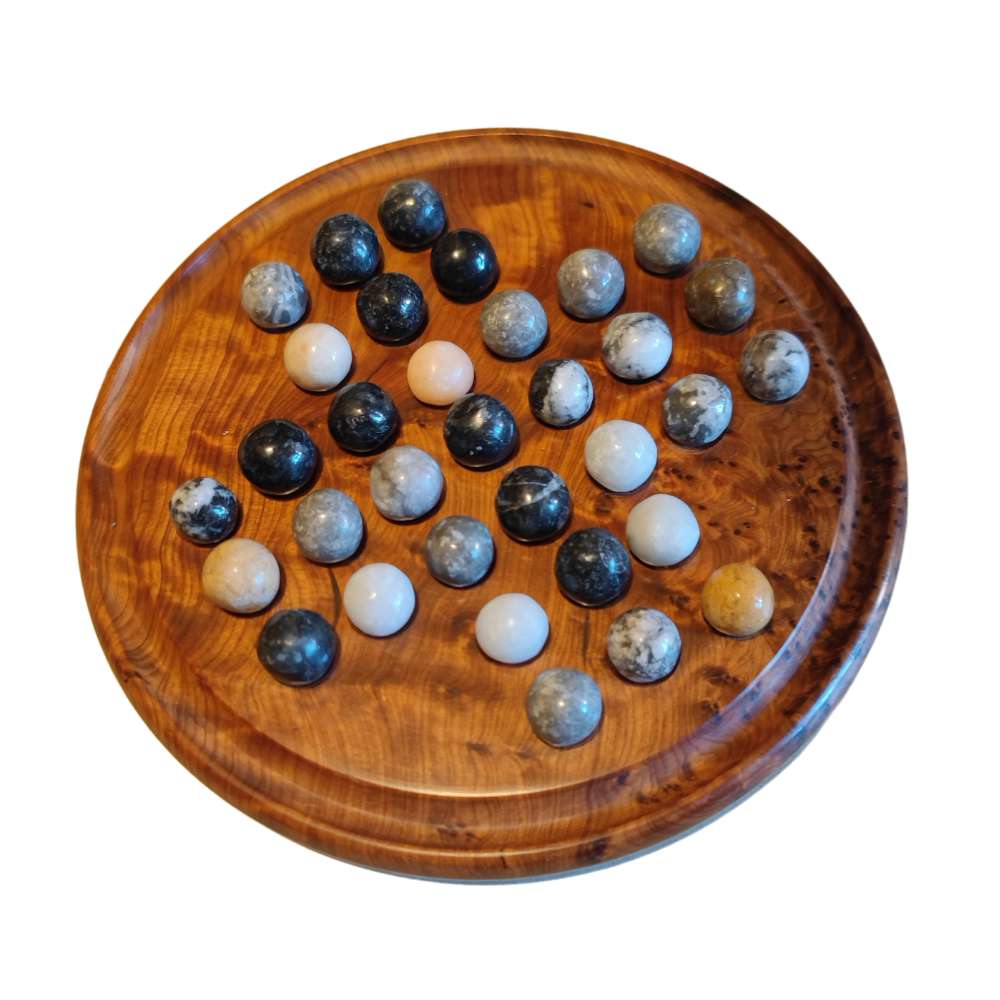 Handmade Thuya Wood Solitaire Set with stone marbles on a circular board crafted by Moroccan artisans.