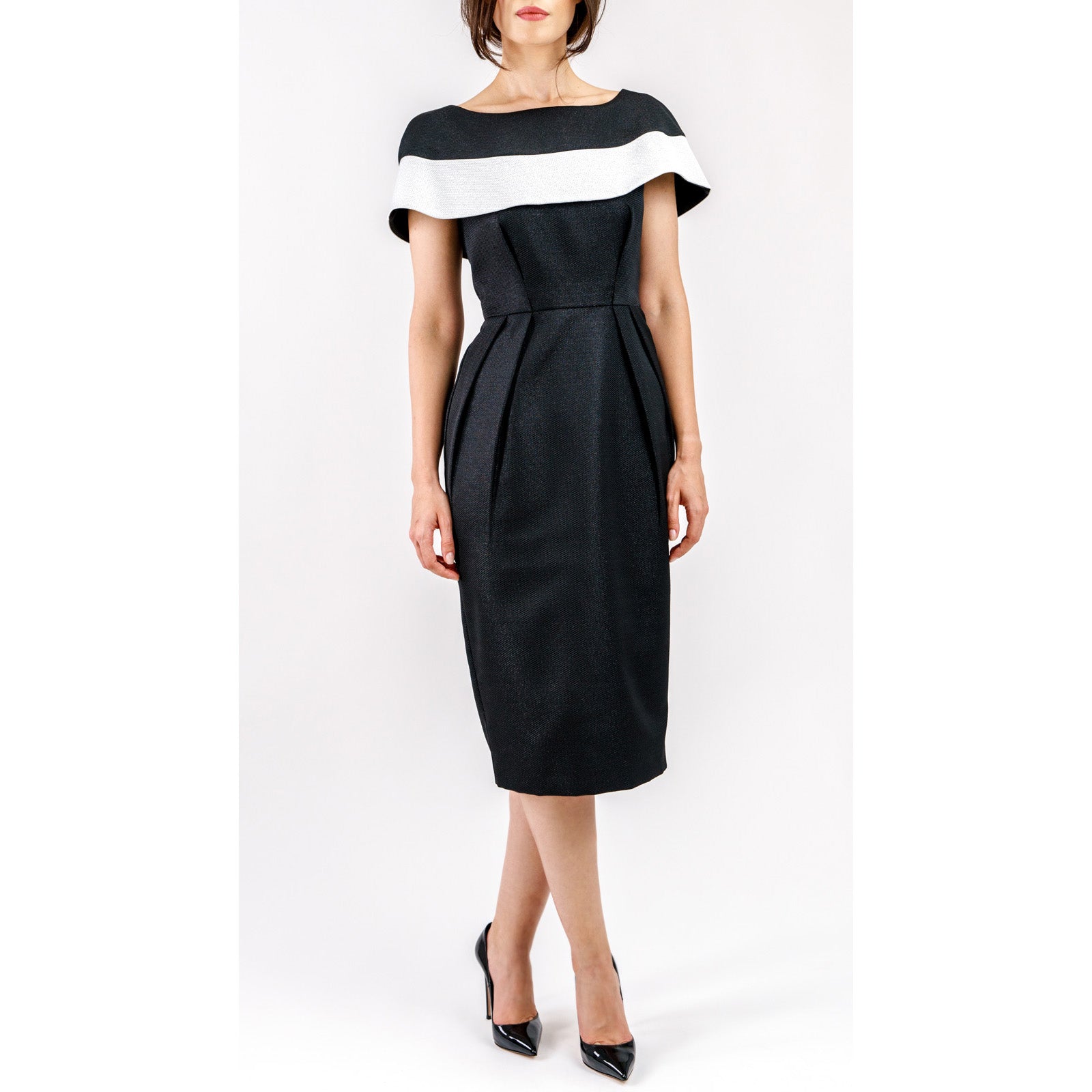 Woman wearing Marcelline Contrast-Collar Midi Dress with sculpted bodice and vintage design. Features black-and-white neckline.