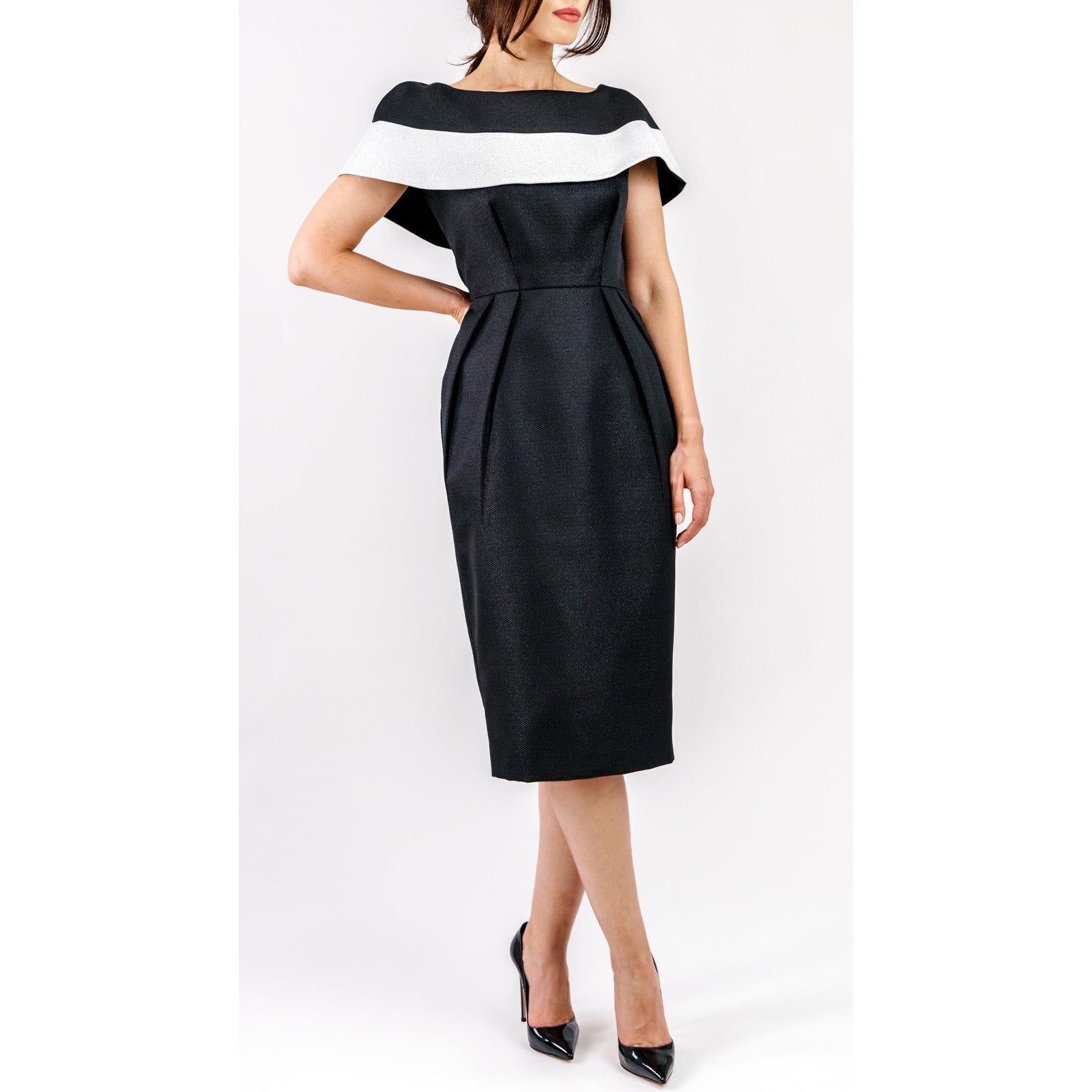 Woman wearing Marcelline Contrast-Collar Midi Dress with black and white neckline, highlighting sculpted bodice and French jacquard fabric.