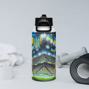 Steel water bottle with Ukrainian soccer emblem and vacuum insulation, shown with gym accessories for hydration and support.