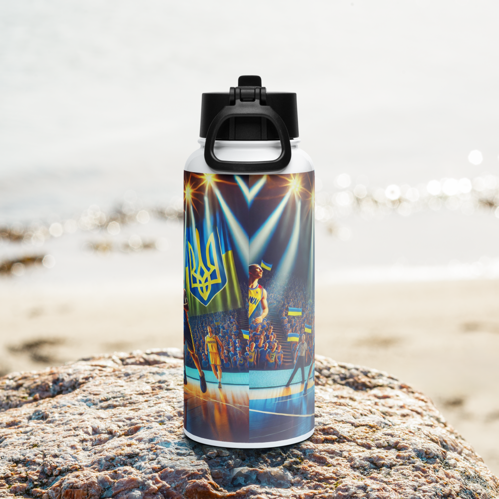 Steel water bottle with Ukrainian basketball emblem on a beach rock, featuring vibrant team graphics.