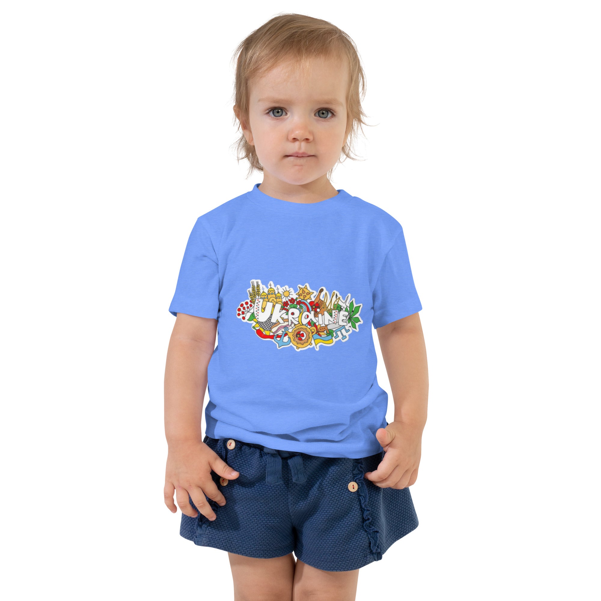 Toddler wearing a blue short sleeve T-shirt with Ukraine-inspired design, showcasing cultural pride and comfort for playtime.