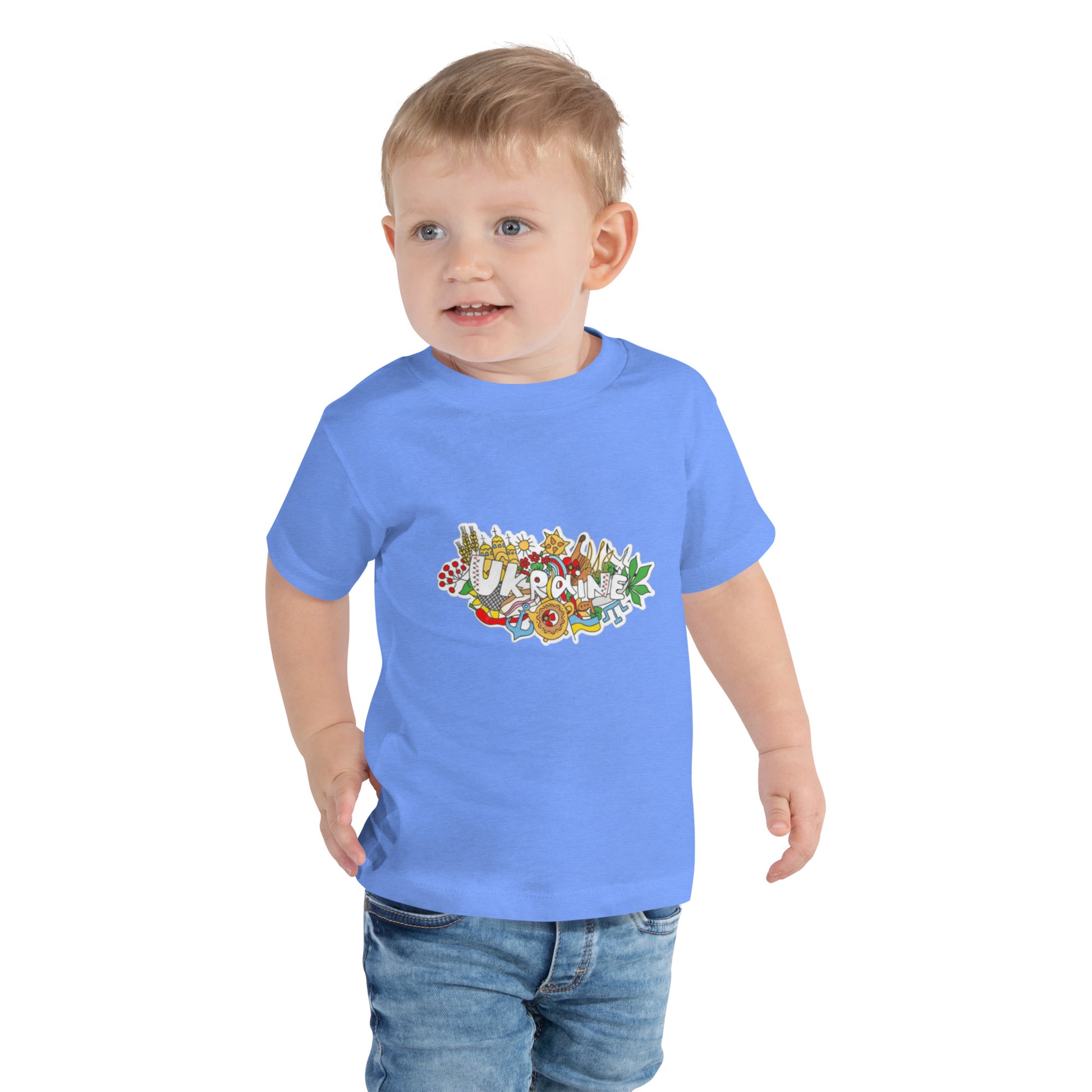 Toddler wearing blue short sleeve T-shirt with Ukraine design, made from 100% cotton for comfort and style.