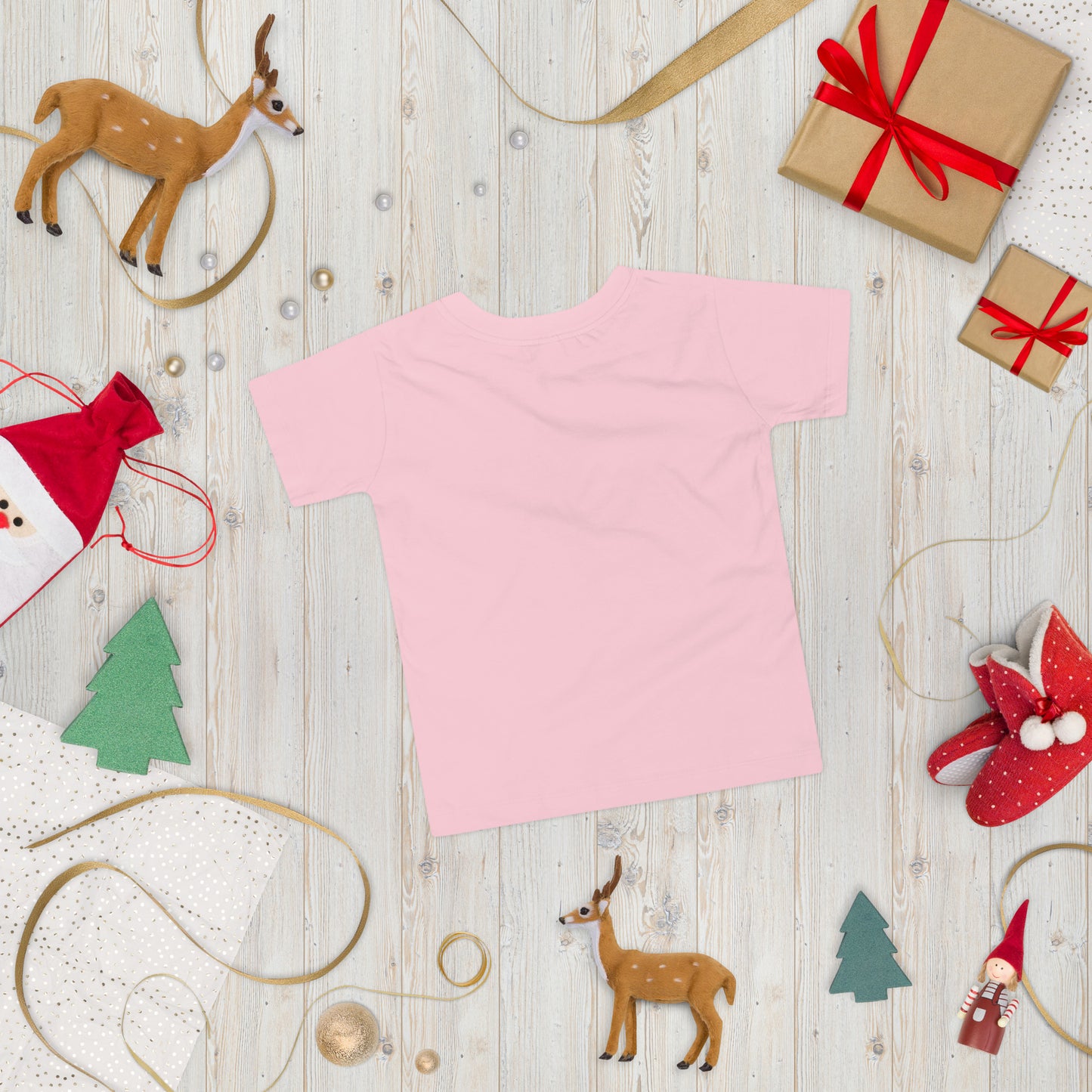 Pink toddler short sleeve T-shirt with holiday-themed decorations, including wrapped gifts and festive ornaments.