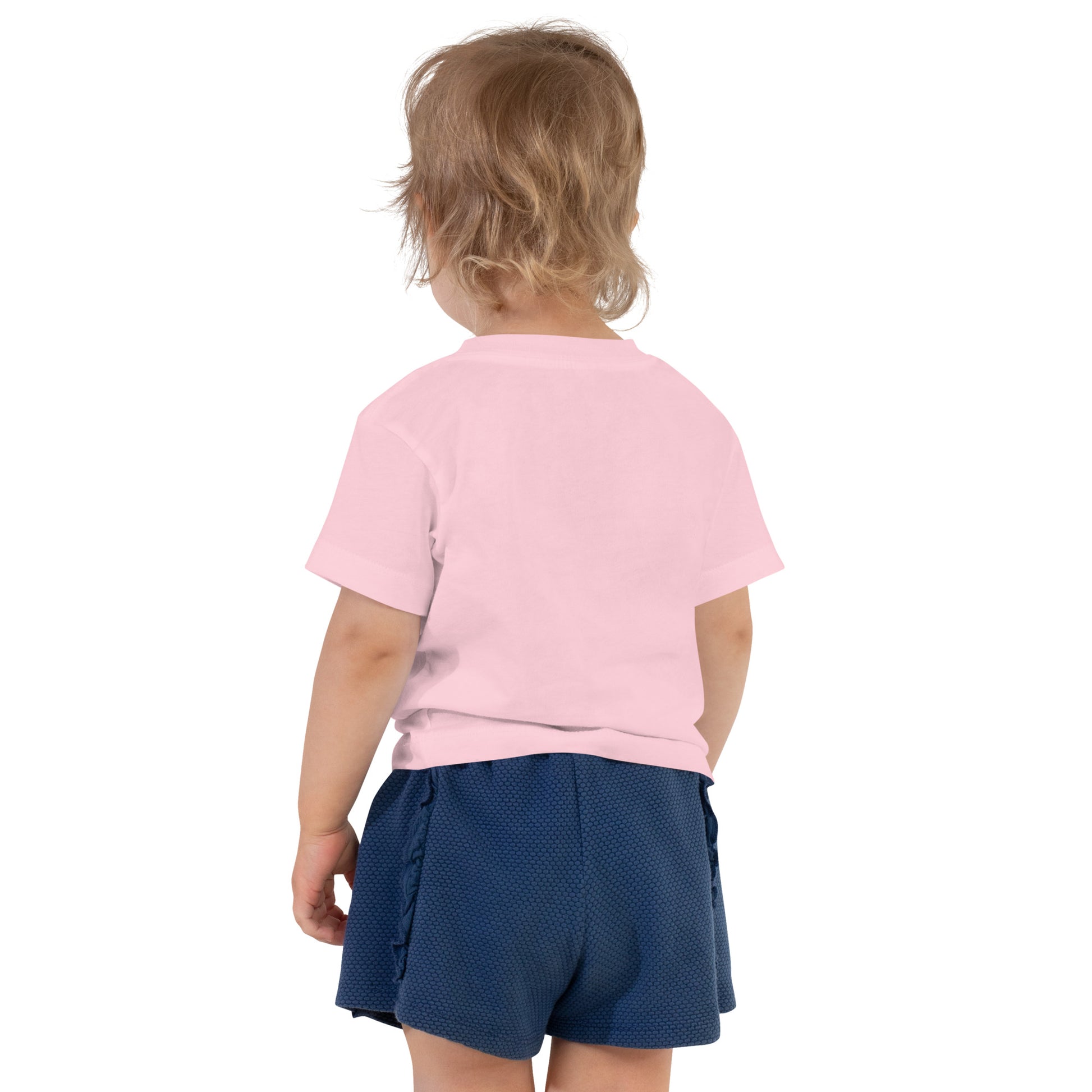 Toddler wearing a pink short sleeve T-shirt with Ukraine design and blue shorts, showcasing comfort and style for active playtime.