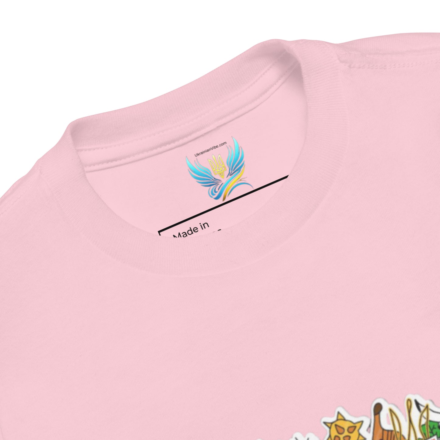 Pink toddler T-shirt with Ukraine-themed design, showcasing embroidered collar and durable cotton fabric for comfort and style.