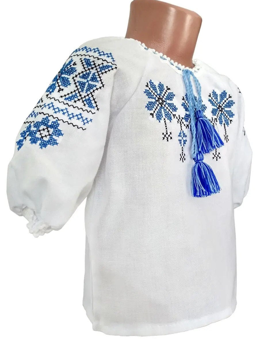 Traditional Ukrainian embroidered girls' blouse with blue ornament design, ages 2-8, perfect for cultural events and everyday wear.