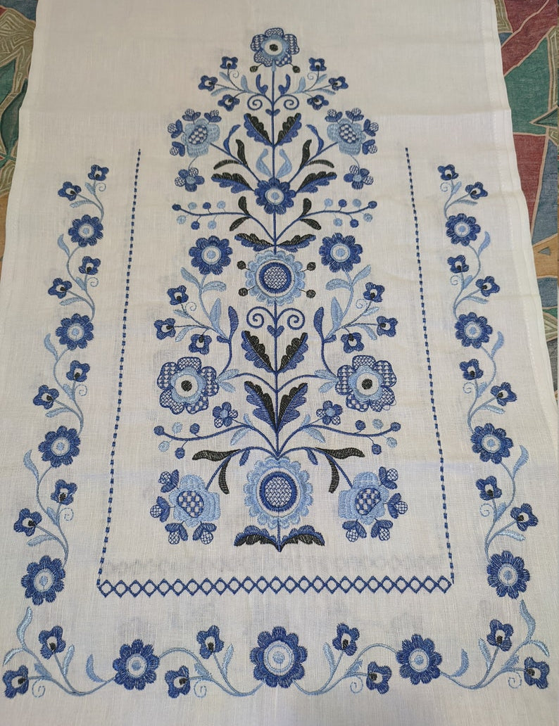 Embroidered Tree of Life design on traditional Ukrainian wedding rushnyk made of 100% linen, featuring blue floral motifs.