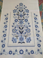 Embroidered Tree of Life design on traditional Ukrainian wedding rushnyk made of 100% linen, featuring blue floral motifs.