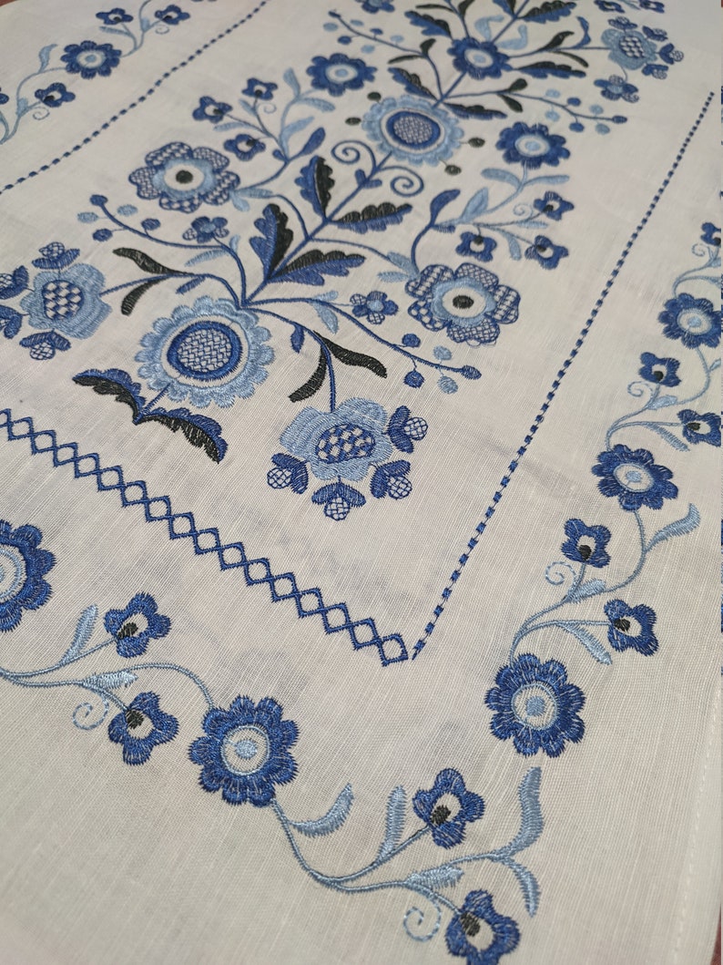 Traditional Ukrainian wedding rushnyk with blue Tree of Life embroidery on linen, perfect for cultural ceremonies and home decor.