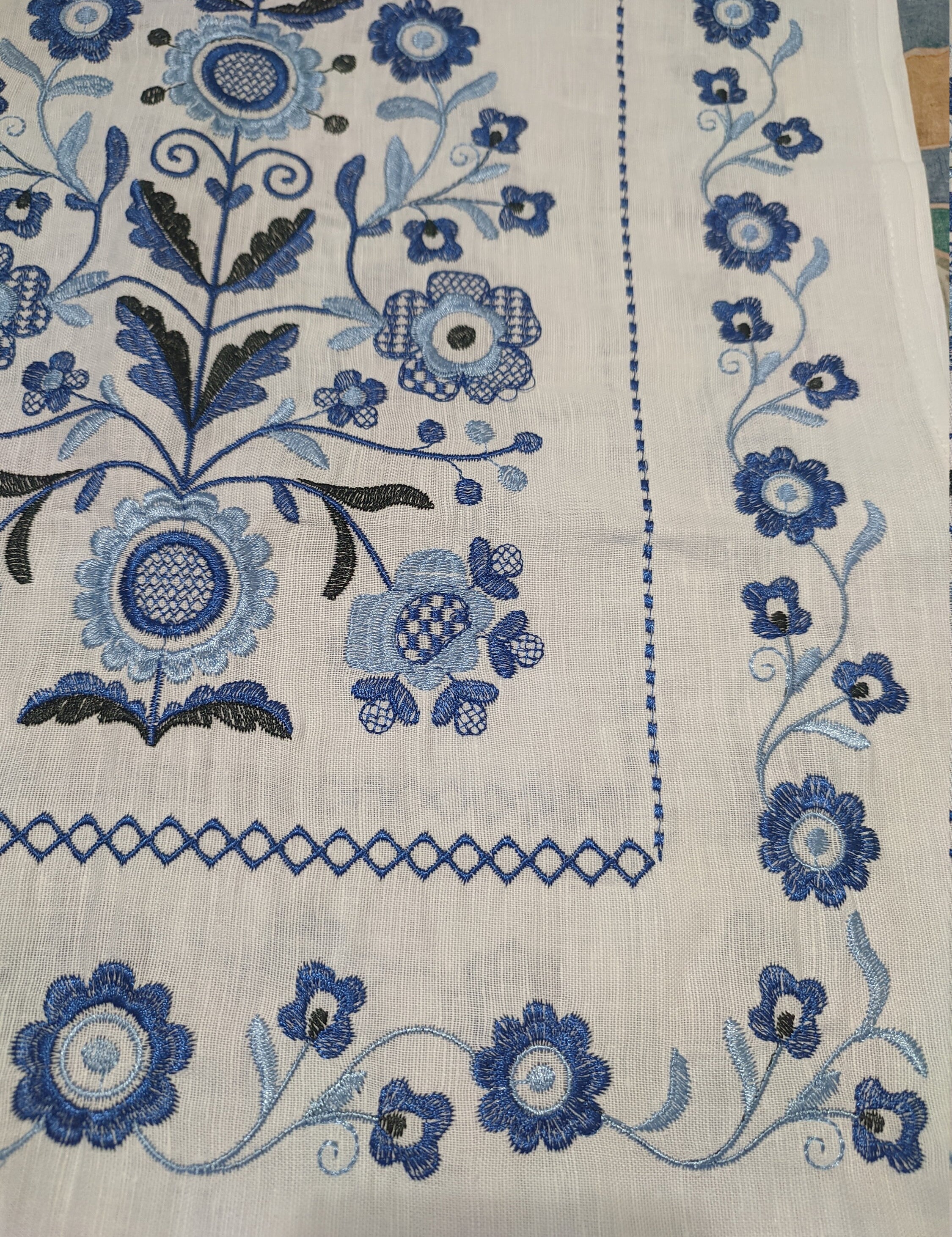 Embroidered Ukrainian wedding rushnyk with blue floral pattern on 100% linen, featuring traditional Tree of Life design.
