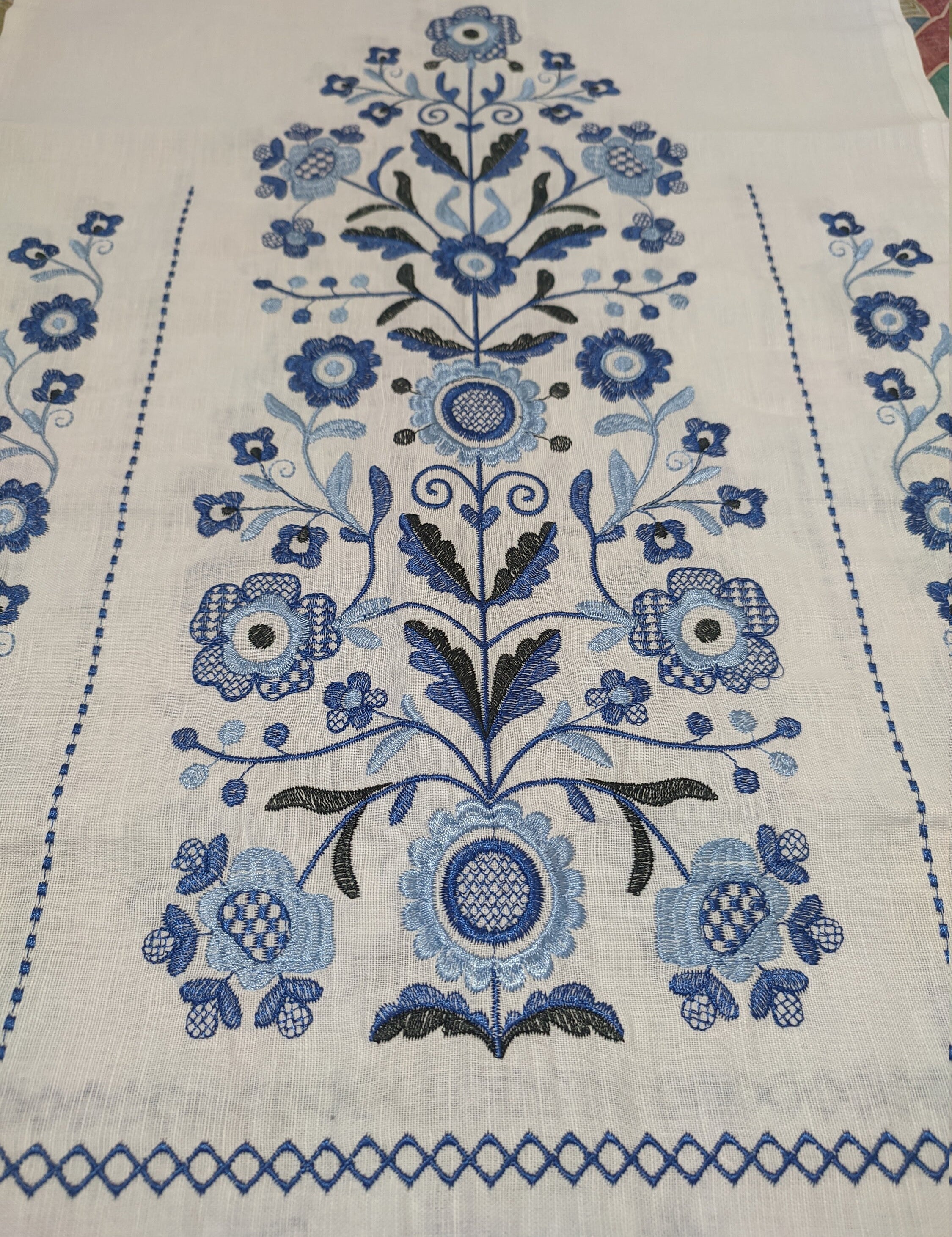 Traditional Ukrainian embroidered rushnyk with blue Tree of Life motif on 100% linen, symbolic of prosperity and protection.