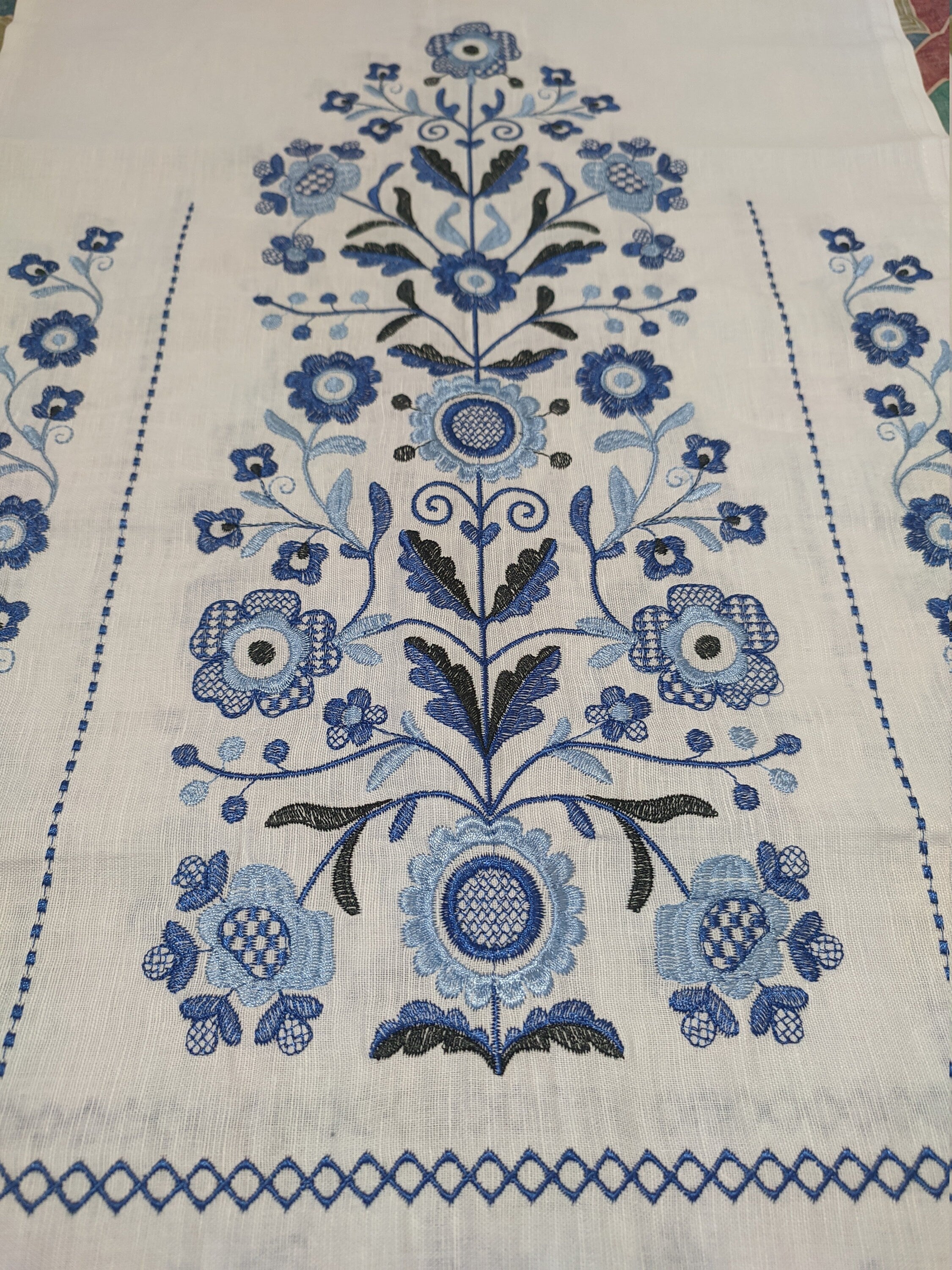 Traditional Ukrainian embroidered rushnyk with blue Tree of Life motif on 100% linen, symbolic of prosperity and protection.