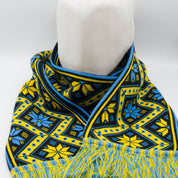 Cozy knit scarf with traditional Ukrainian geometric pattern in yellow and blue, hypoallergenic, perfect for winter warmth.