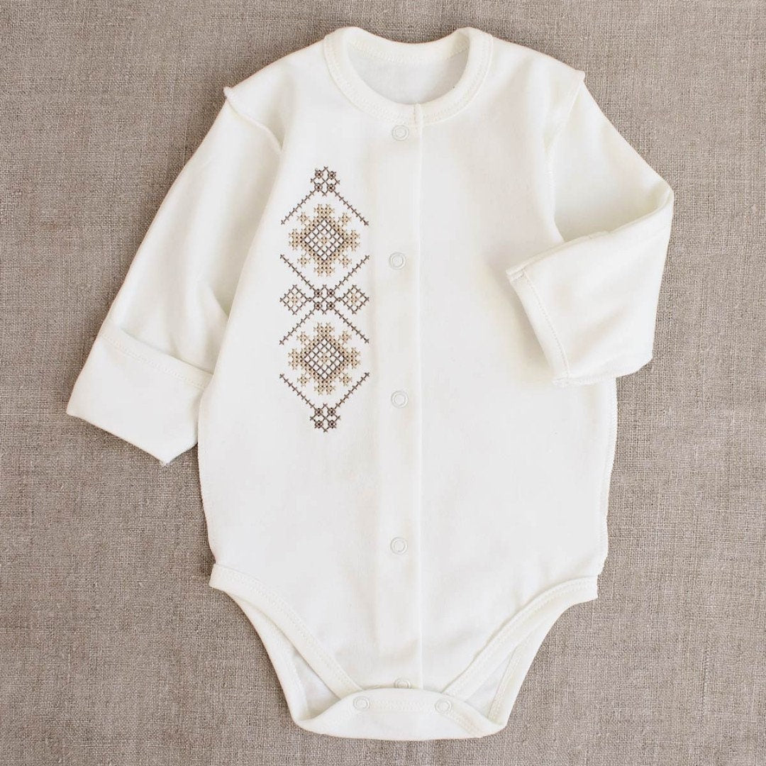 Ukrainian embroidered baby romper in beige-brown, Vyshyvanka style, ideal for newborns, coming-home outfit, or baby shower gift.
