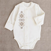 Ukrainian embroidered baby romper with beige-brown patterns, classic Vyshyvanka style, ideal newborn coming-home outfit or baby shower gift.