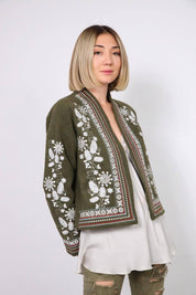 Stylish khaki embroidered jacket with traditional Ukrainian Vyshyvanka design, featuring intricate patterns and cultural elegance.