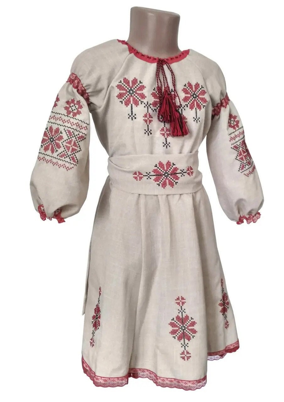 Ukrainian embroidered linen dress with red floral Rosava motif for girls, featuring 3/4 sleeves and belt, traditional Vyshyvanka style.