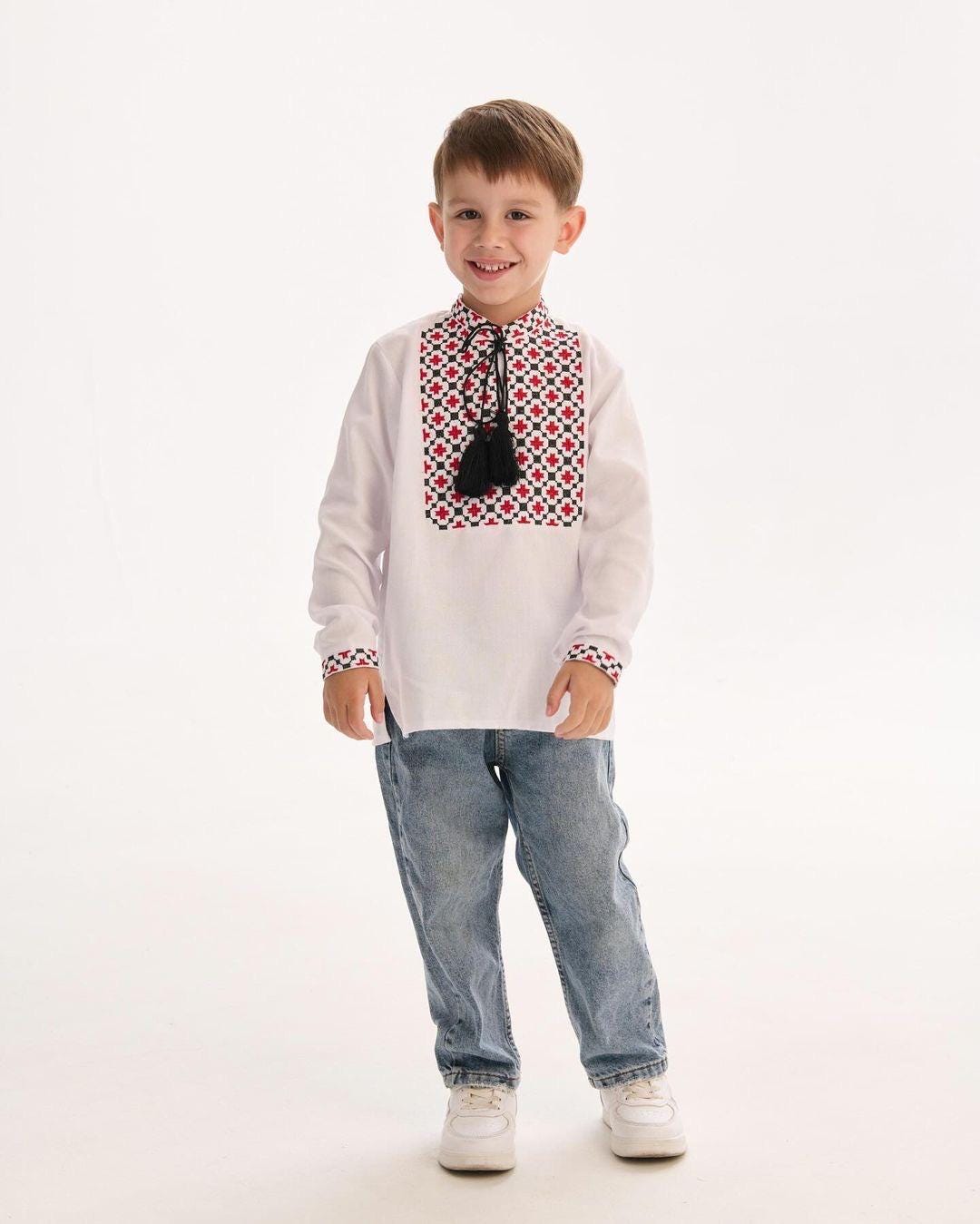 Young boy wearing a traditional Ukrainian vyshyvanka shirt with intricate Slavic embroidery.