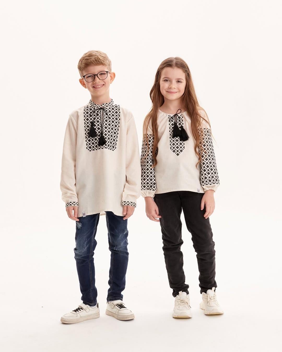 Children wearing Ukrainian embroidered shirts with Slavic folk designs, showcasing vibrant cultural motifs and soft, breathable fabric.