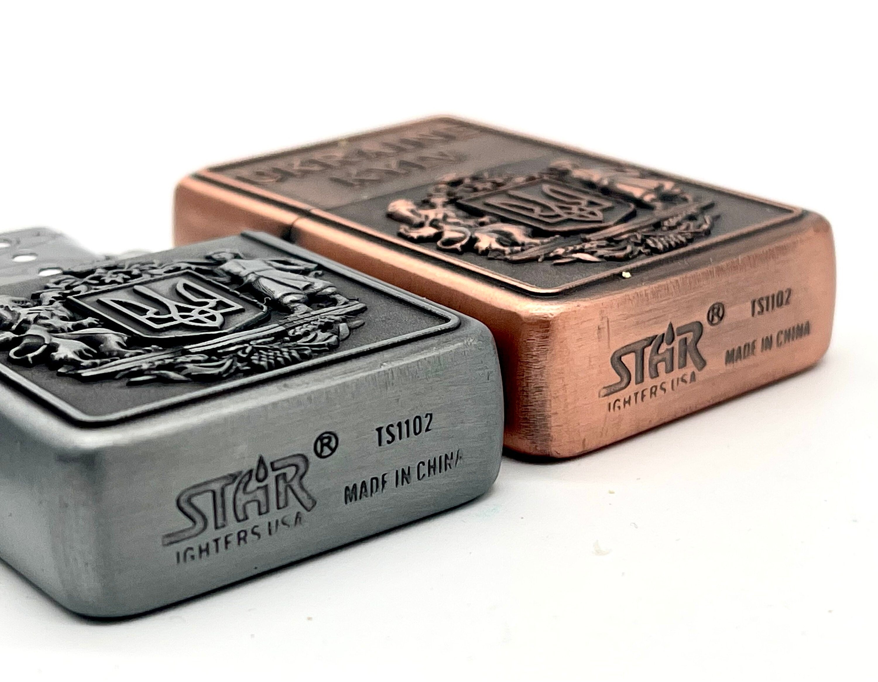 Ukrainian gasoline lighter with bronze and silver coat of arms, featuring national symbol for collectors and everyday use.