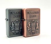 Ukrainian gasoline lighters with bronze and silver coat of arms, showcasing national symbol and collectible design.