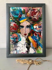 Contemporary folk art painting of a Ukrainian girl in an ethnic wreath, vibrant colors, home decor piece by Ukrainian artist.