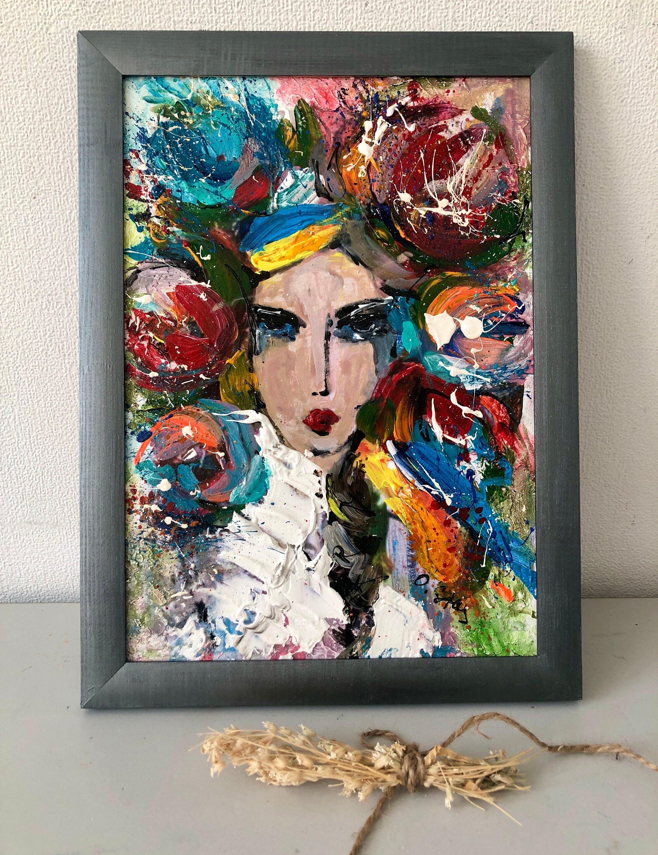 Contemporary folk art painting of a Ukrainian girl in an ethnic wreath, vibrant colors, home decor piece by Ukrainian artist.