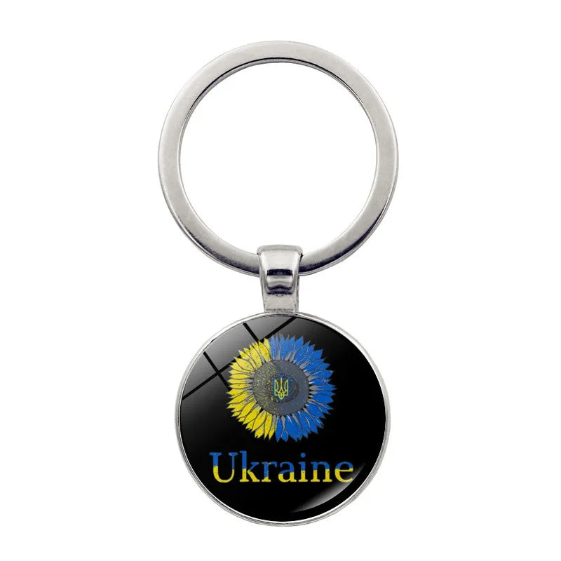 Ukrainian glass keychain with emblem, featuring a colorful design representing Ukrainian heritage and pride.