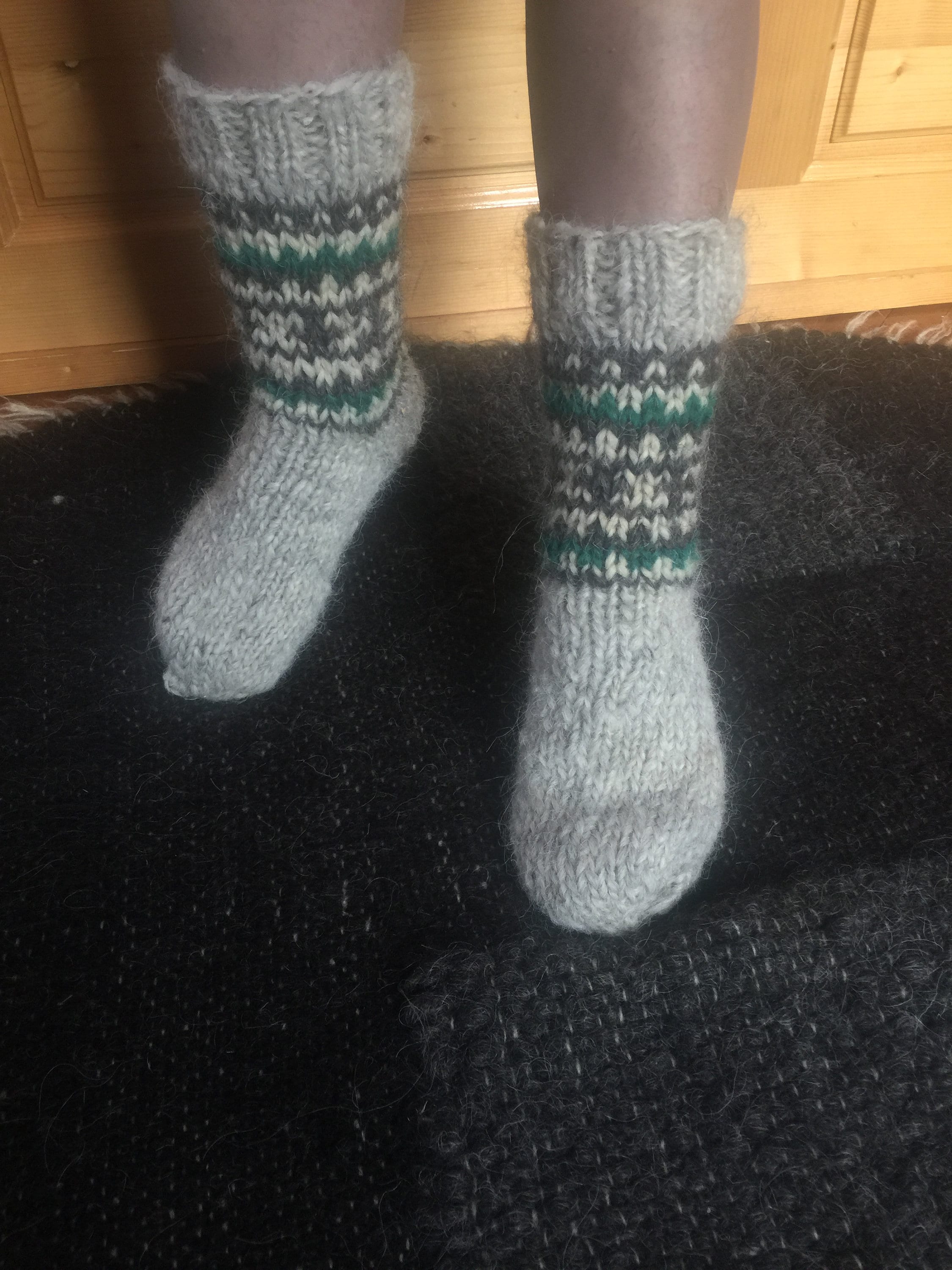 Handmade wool socks from Ukraine providing warmth and foot massage with unique pattern design.