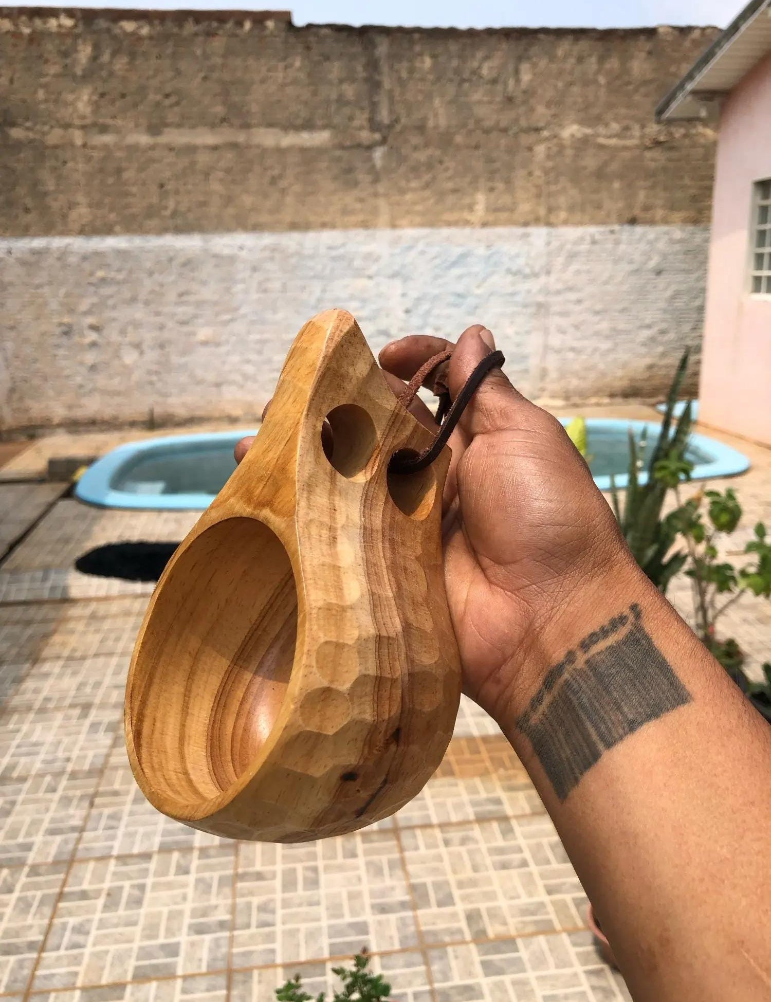 Handcrafted Ukrainian wooden kuksa mug, 200ml, ideal for coffee or tea, showcasing rustic design, eco-friendly material, outdoor use.