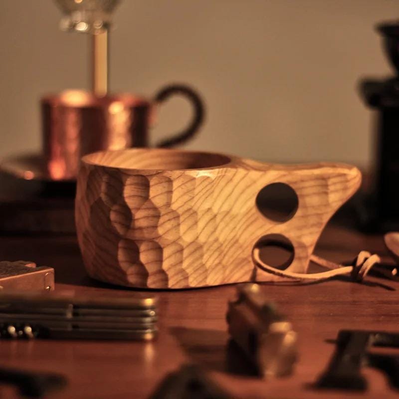 Handmade Ukrainian wooden kuksa mug, rustic 200ml cup for coffee and tea, eco-friendly design reflecting Nordic craftsmanship.