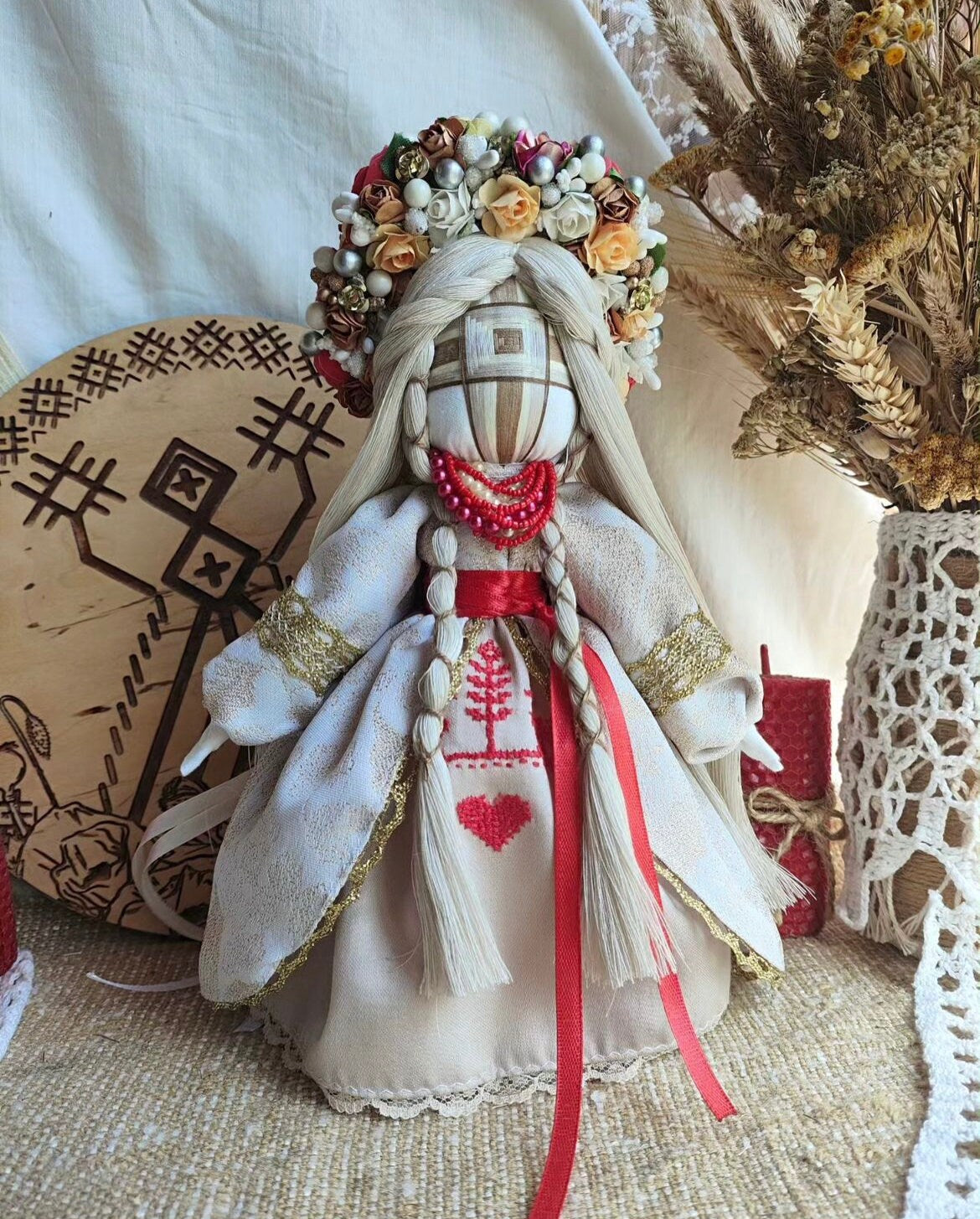 Handmade Motanka Doll, traditional Ukrainian talisman for protection and prosperity, cultural souvenir with floral crown and embroidered dress.