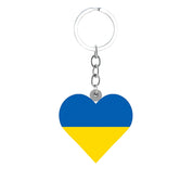 Heart-shaped acrylic keychain featuring the blue and yellow colors of the Ukrainian flag, symbolizing pride and unity.