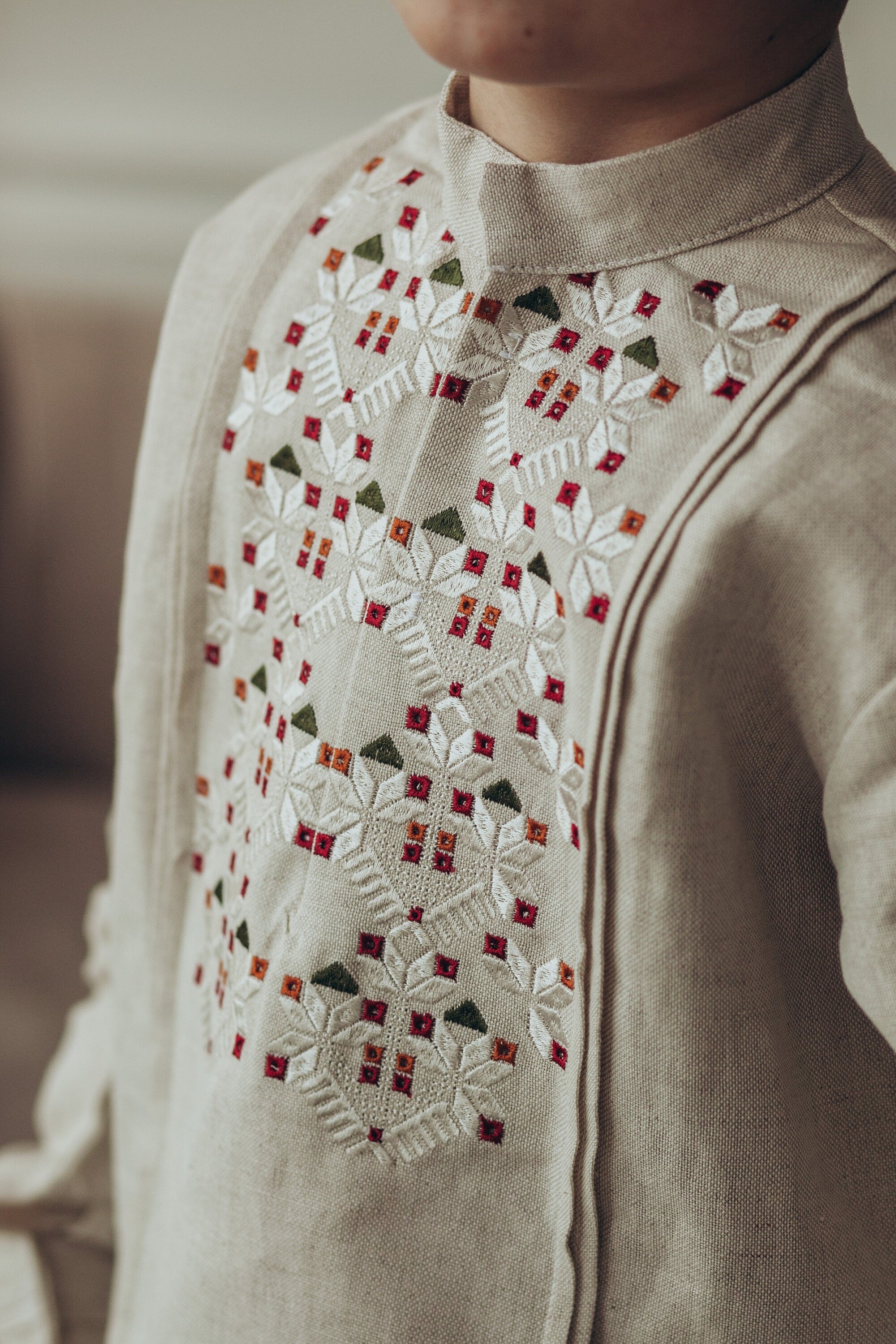 Ukrainian linen vyshyvanka shirt for boys with colorful embroidery on high-quality fabric, showcasing traditional design.
