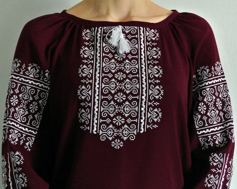 Marsala boho Vyshyvanka blouse with white geometric embroidery, featuring traditional Ukrainian design elements.