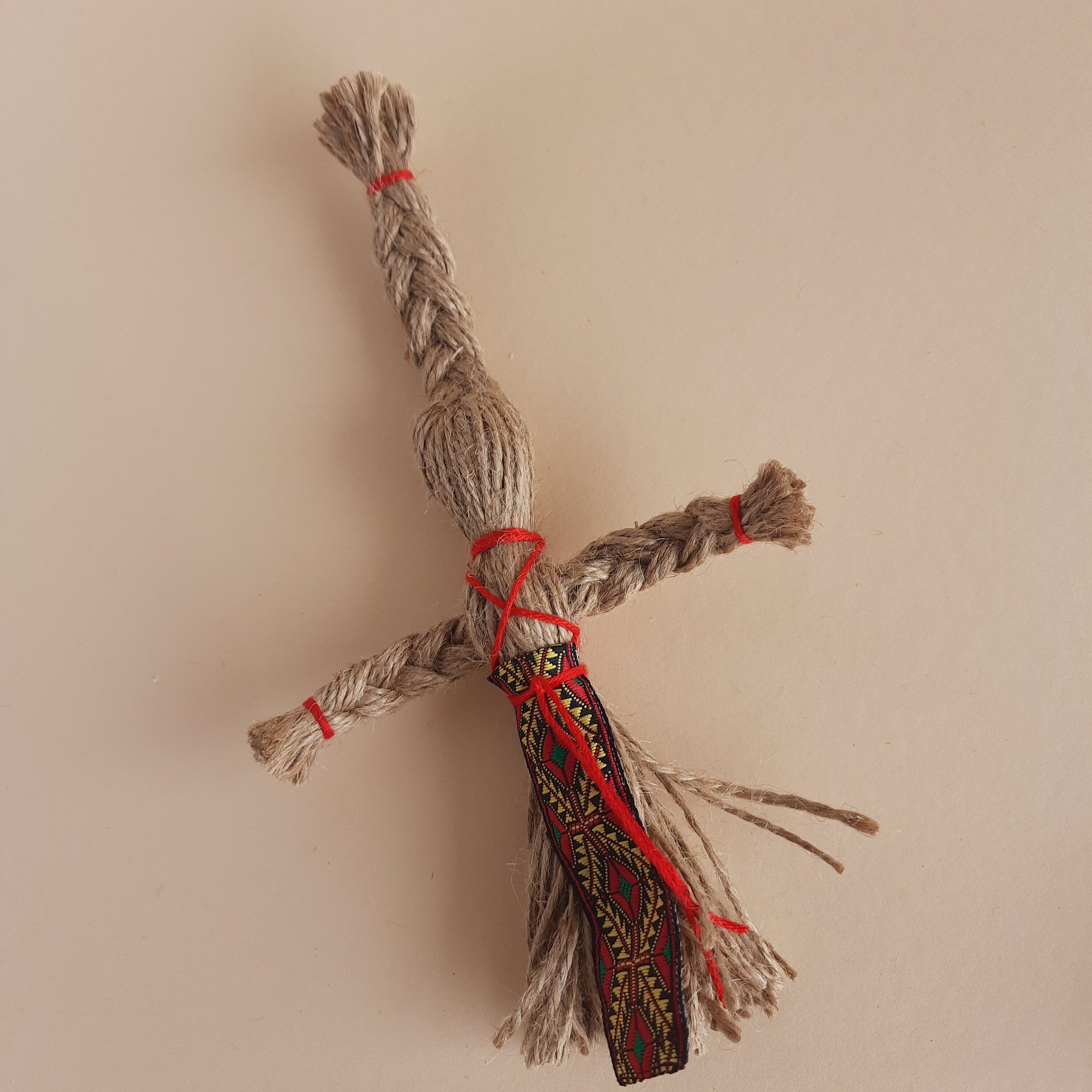 Miniature Motanka Doll, handcrafted jute twine, Ukrainian folk art, unique rustic charm, cultural home decor collectible.