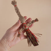 Handmade Miniature Motanka Doll made from jute twine, showcasing traditional Ukrainian folk art and rustic charm in a hand.