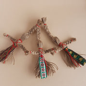 Handmade Ukrainian Motanka dolls with rustic jute twine and colorful embroidered details, traditional folk art charm.
