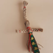 Miniature handmade Motanka doll with jute twine and colorful ribbon, traditional Ukrainian folk art and home decor collectible.